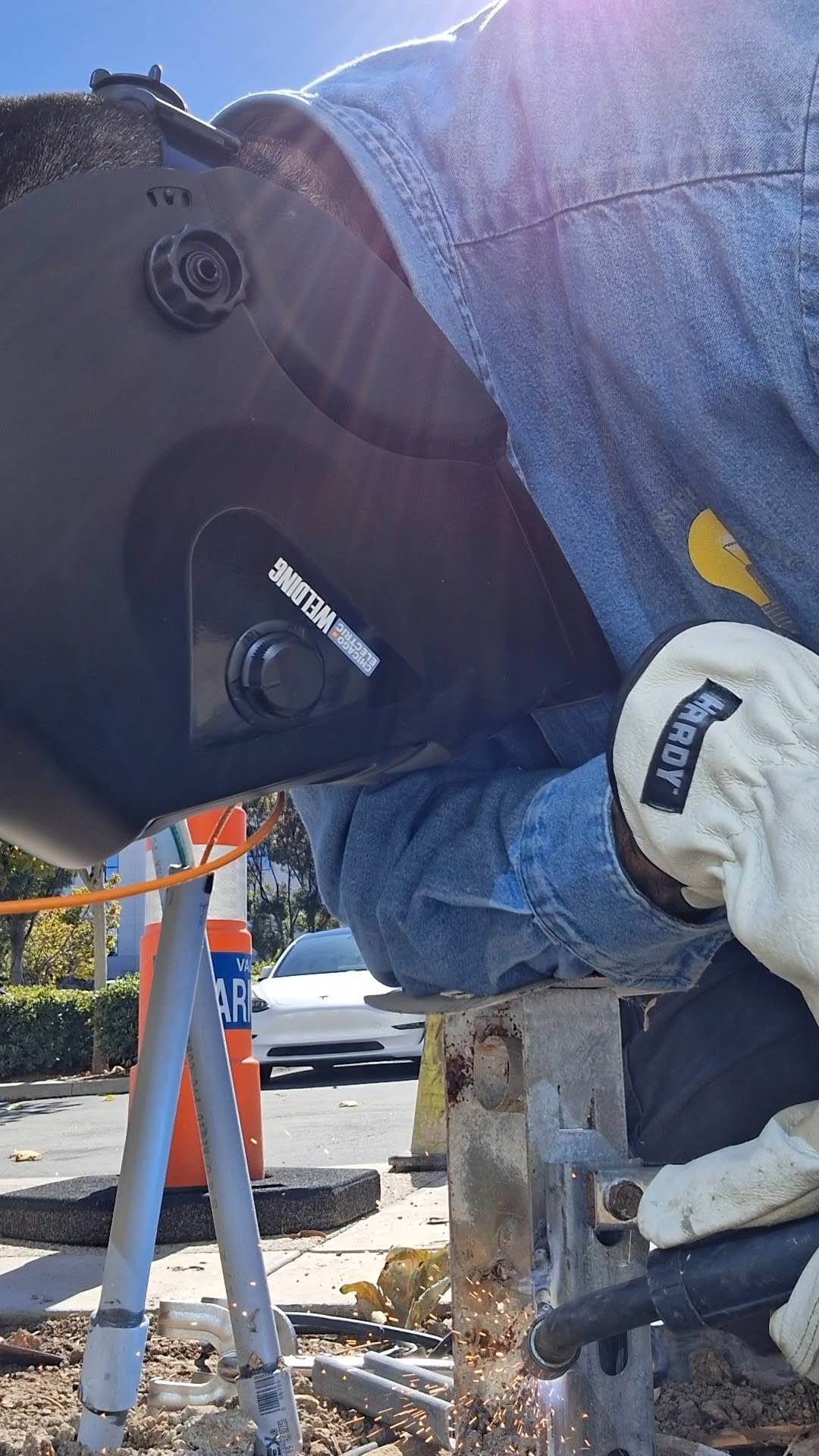 Cervantes Electric welding a metal frame on site