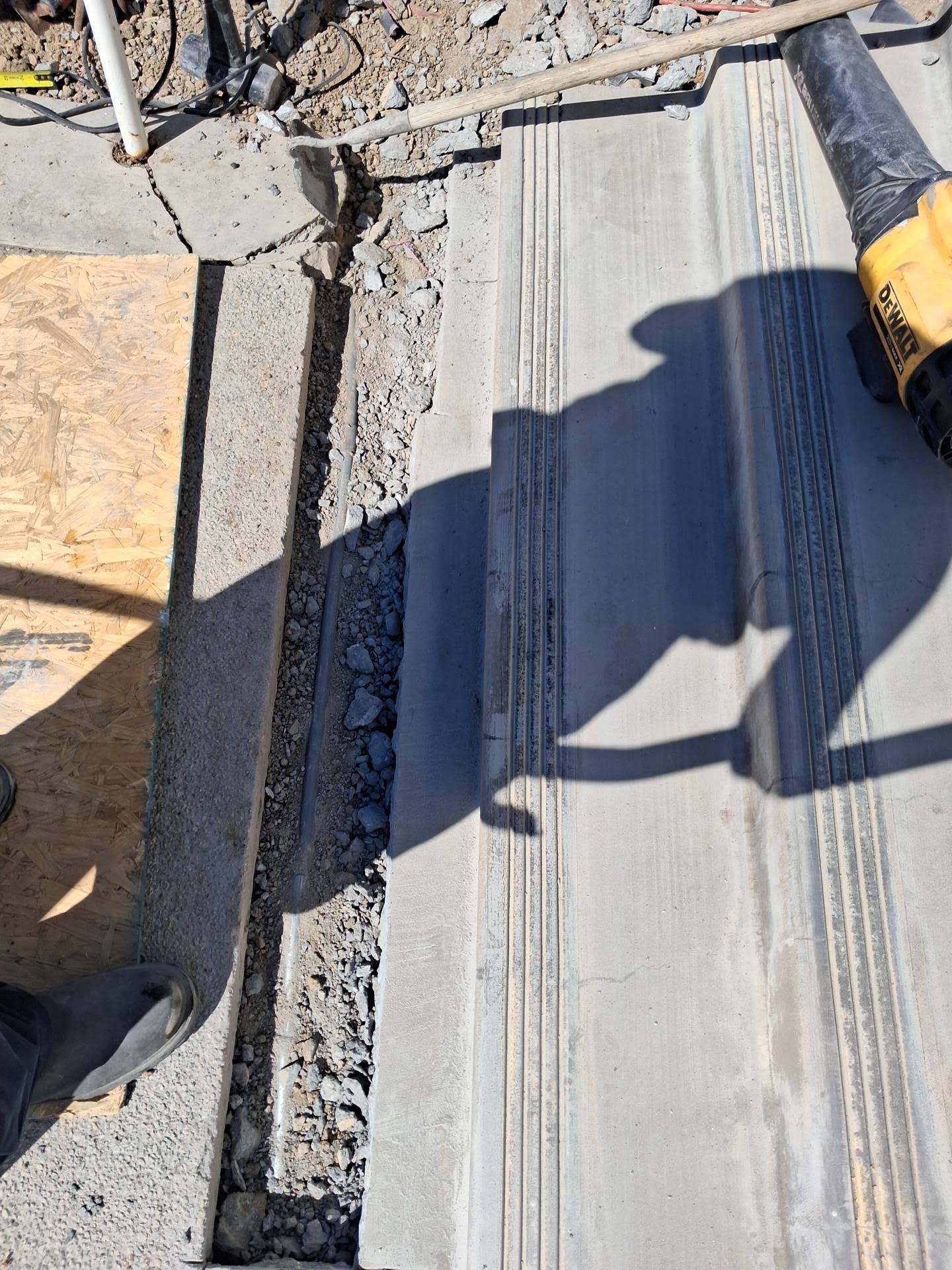 Concrete demolition with a power tool during excavation